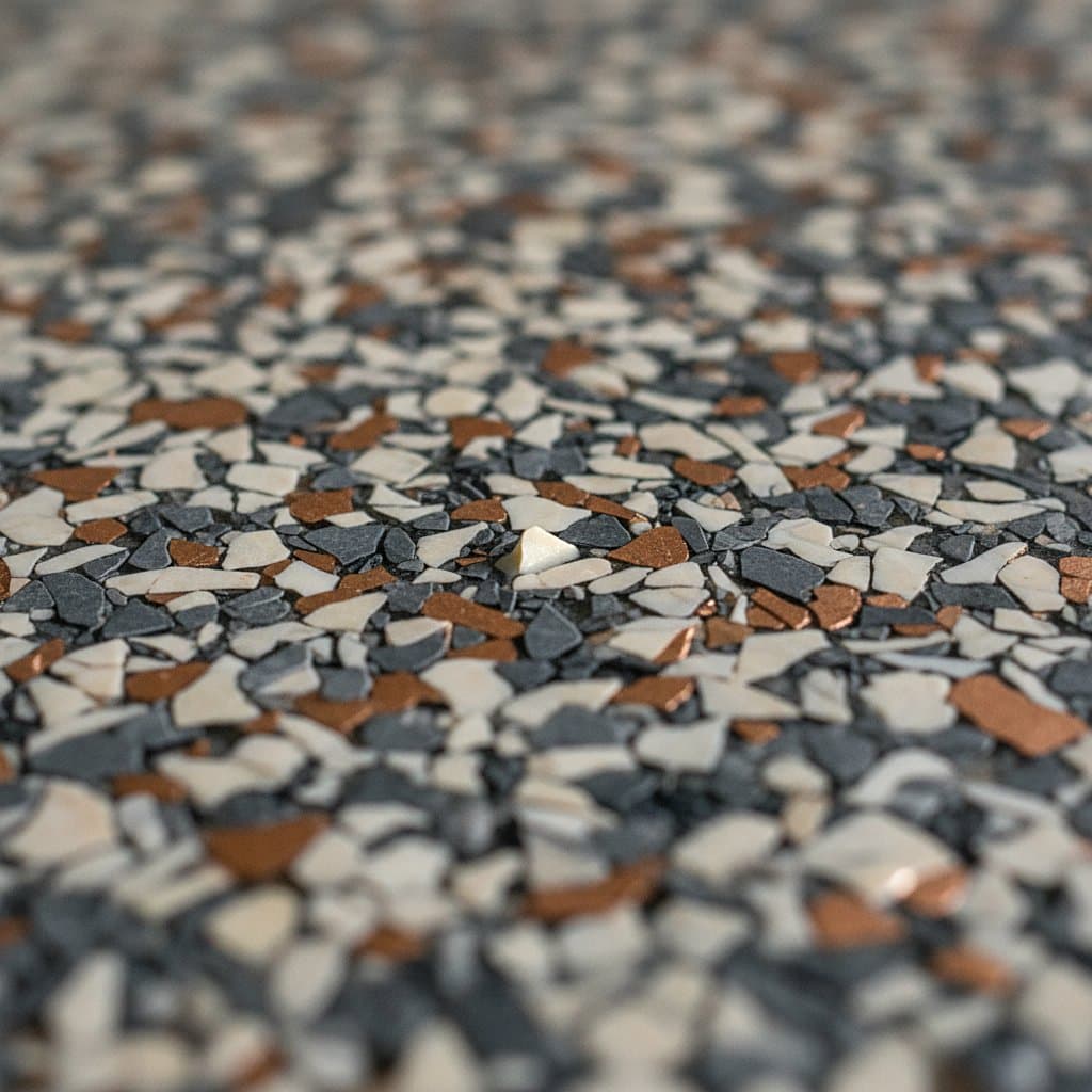 Macro of dense charcoal, cream and copper flake field.